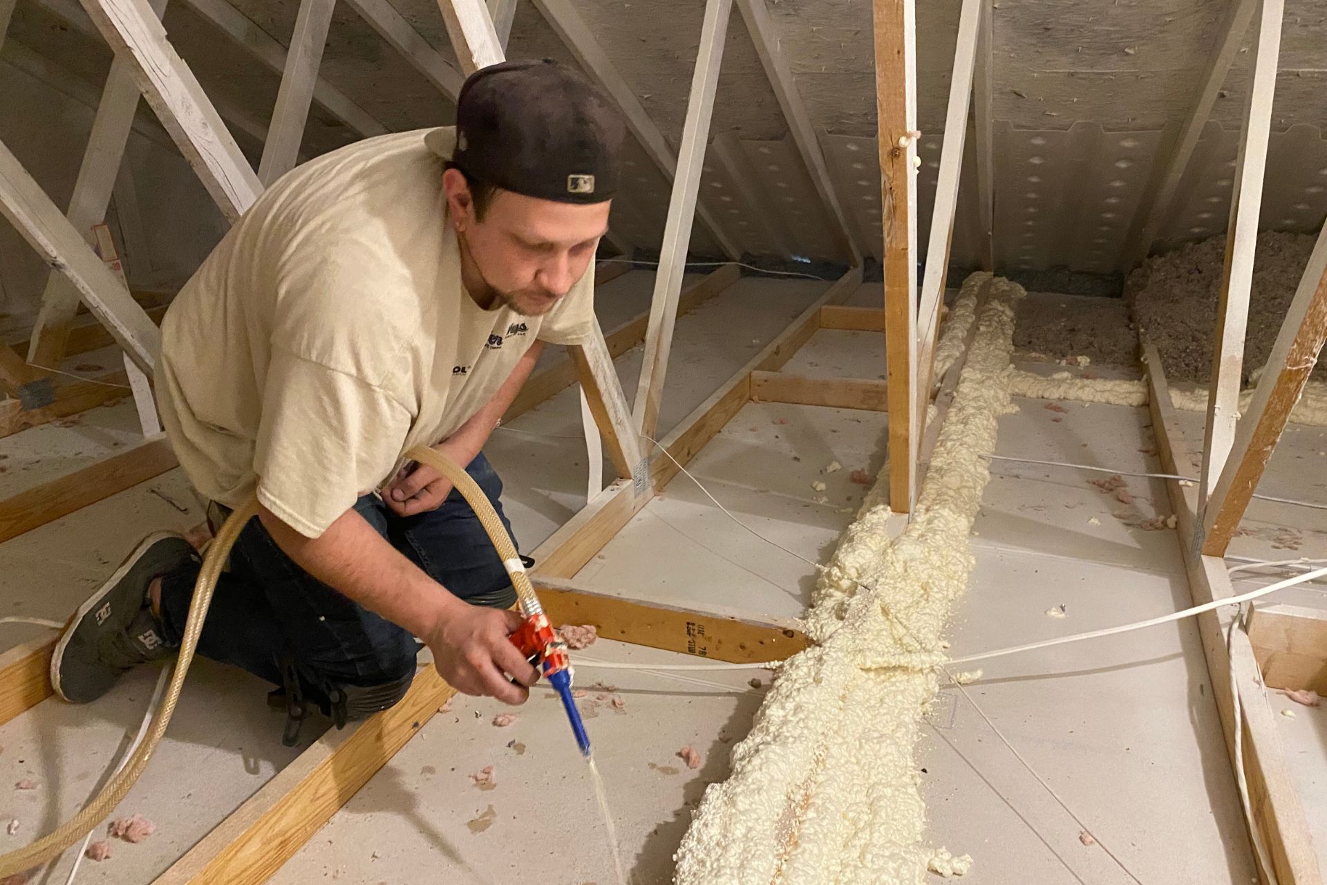 Ver Wys foam sealing the attic before blowing in insulation